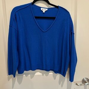 Bright Blue sweater with exposed hems